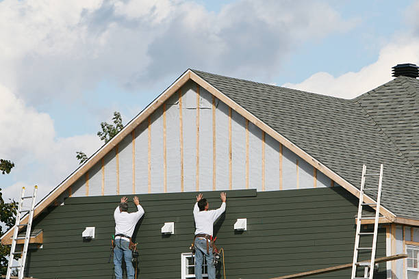 Professional Siding technician working in Avon, IN